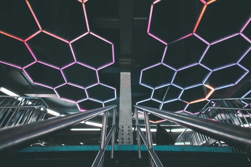 Stairs leading up with hexagon neon lights
